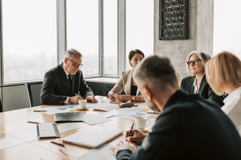 People around a table in an office