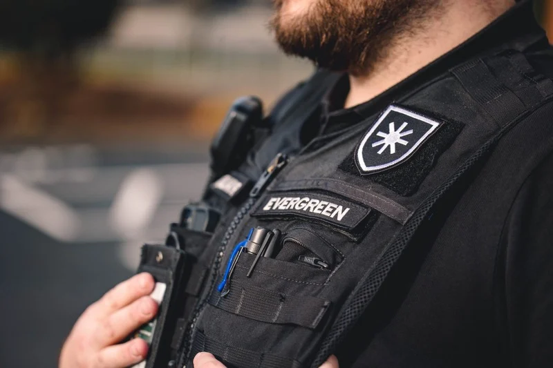 Uniformed armored truck personnel